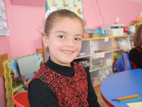 Girl in school in the West Bank in traditional Palestinian dress